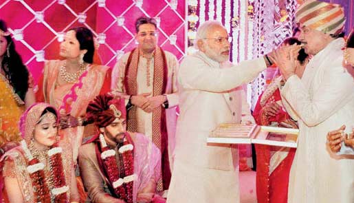 Prime Minister Narendra Modi feeds a sweet to BJP MP shatrughan sinha