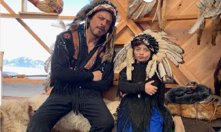 shah rukh khan with son abram khan posing at their vacation